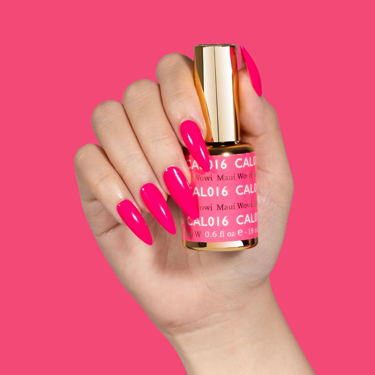 Hand with long pink stiletto nails holding a DND gel polish bottle, pink background