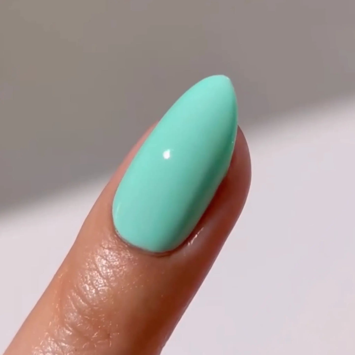Close-up of a medium almond nail in mint green, DIVA #273 Sound Of Rain