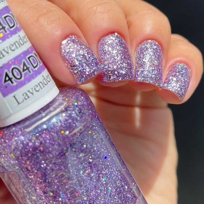 Hand with short square nails wearing Lavender Daisy Star purple glitter nail polish with silver flecks