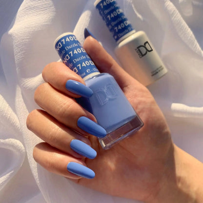 A powder soft periwinkle blue with vibrant undertones unique shade on long oval nails