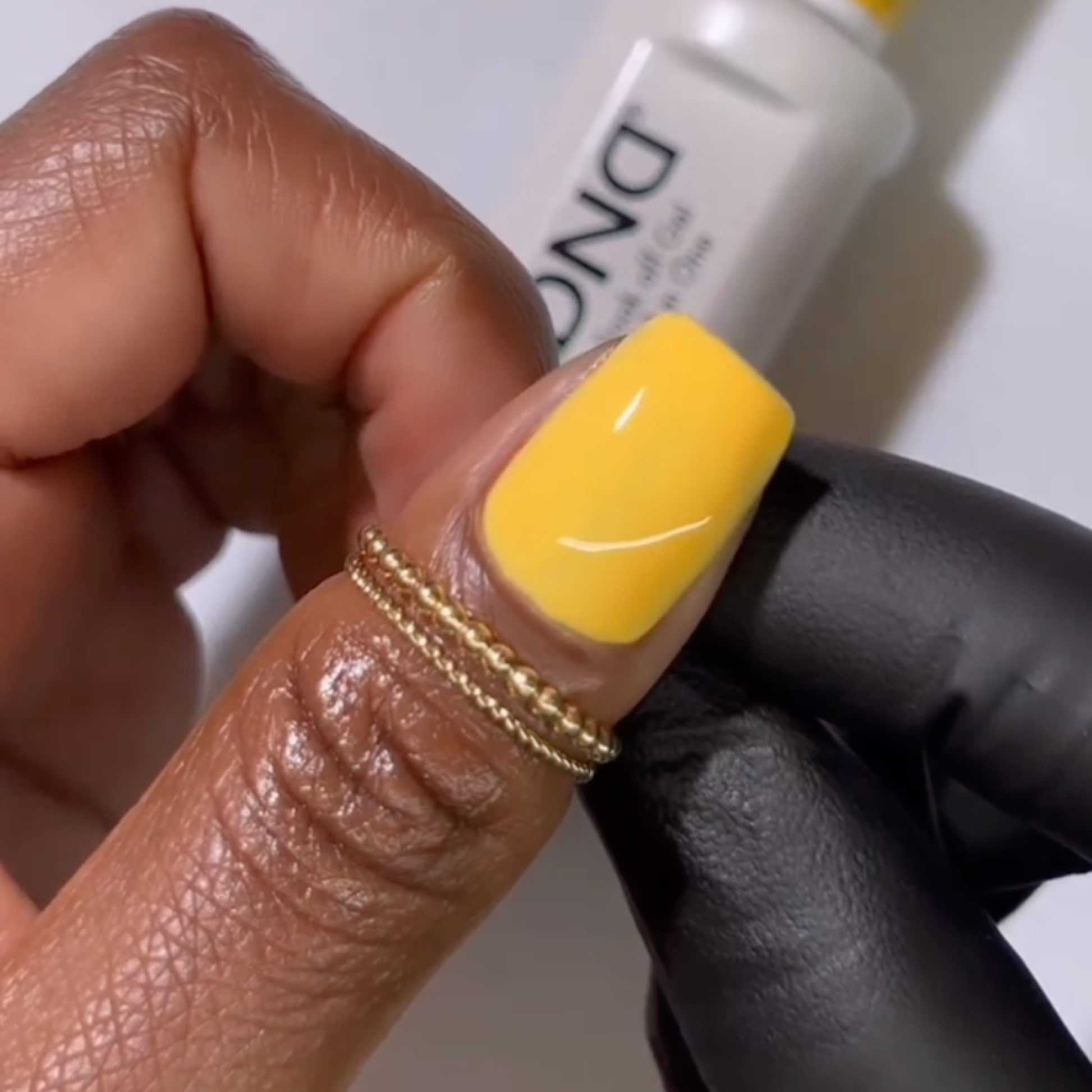Honey nail polish color on short square nails with warm golden tone