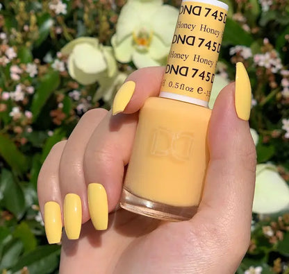 a honey-colored polish with warm golden tone on coffin shaped nails