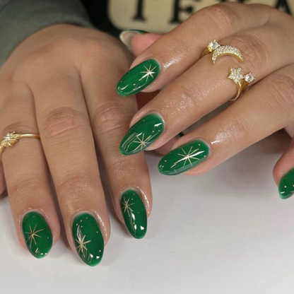 Glossy vibrant jade green nails and gold star nail art on medium round nails