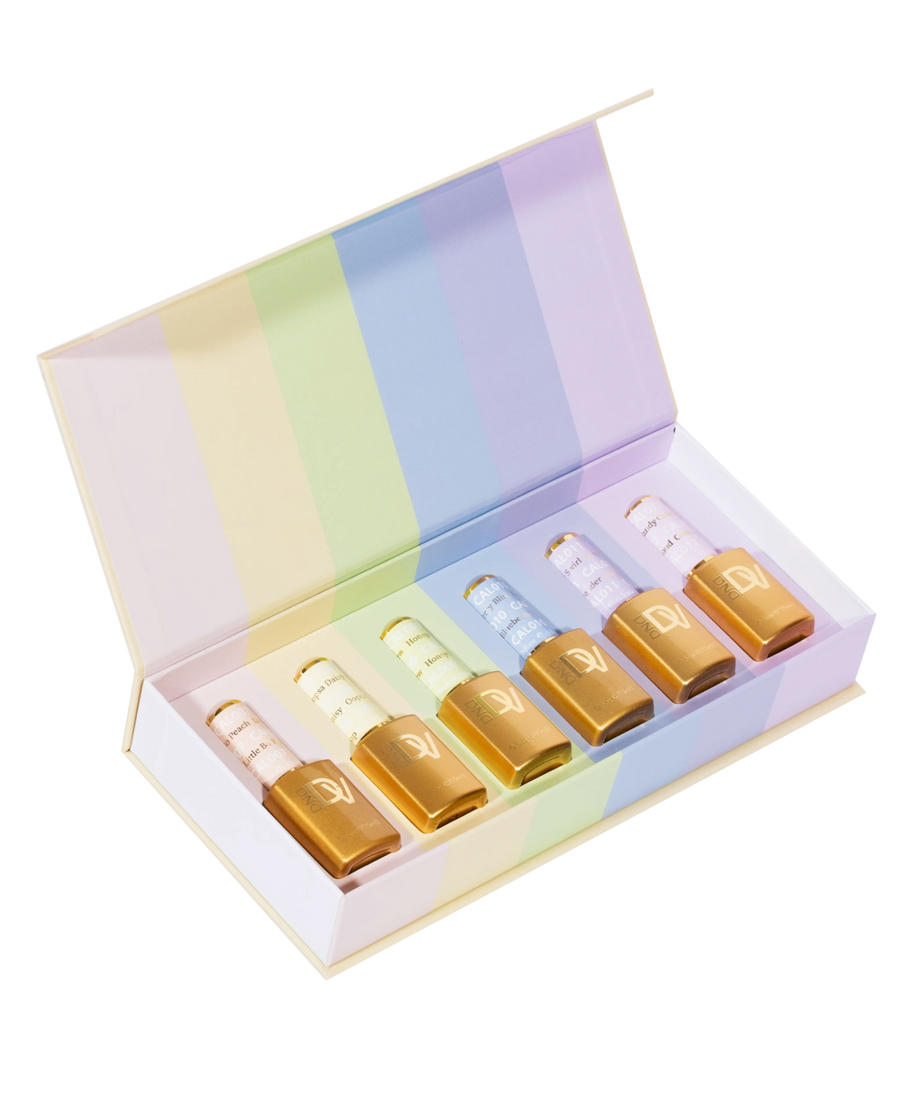 Open pastel rainbow-striped box revealing six amber dropper bottles inside