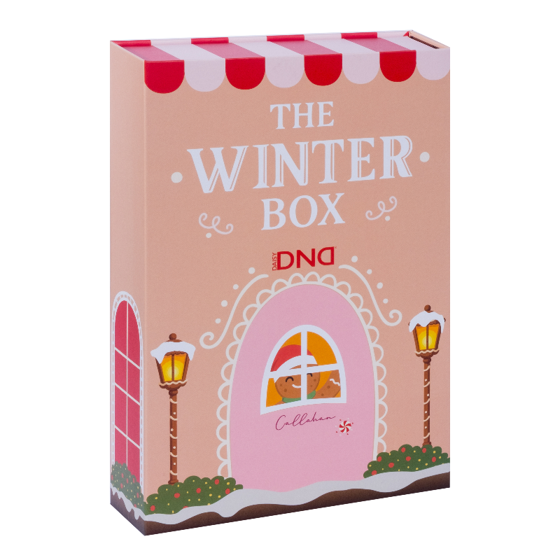 The DND Winter Box gift set packaging, illustrated with a pink gingerbread house design